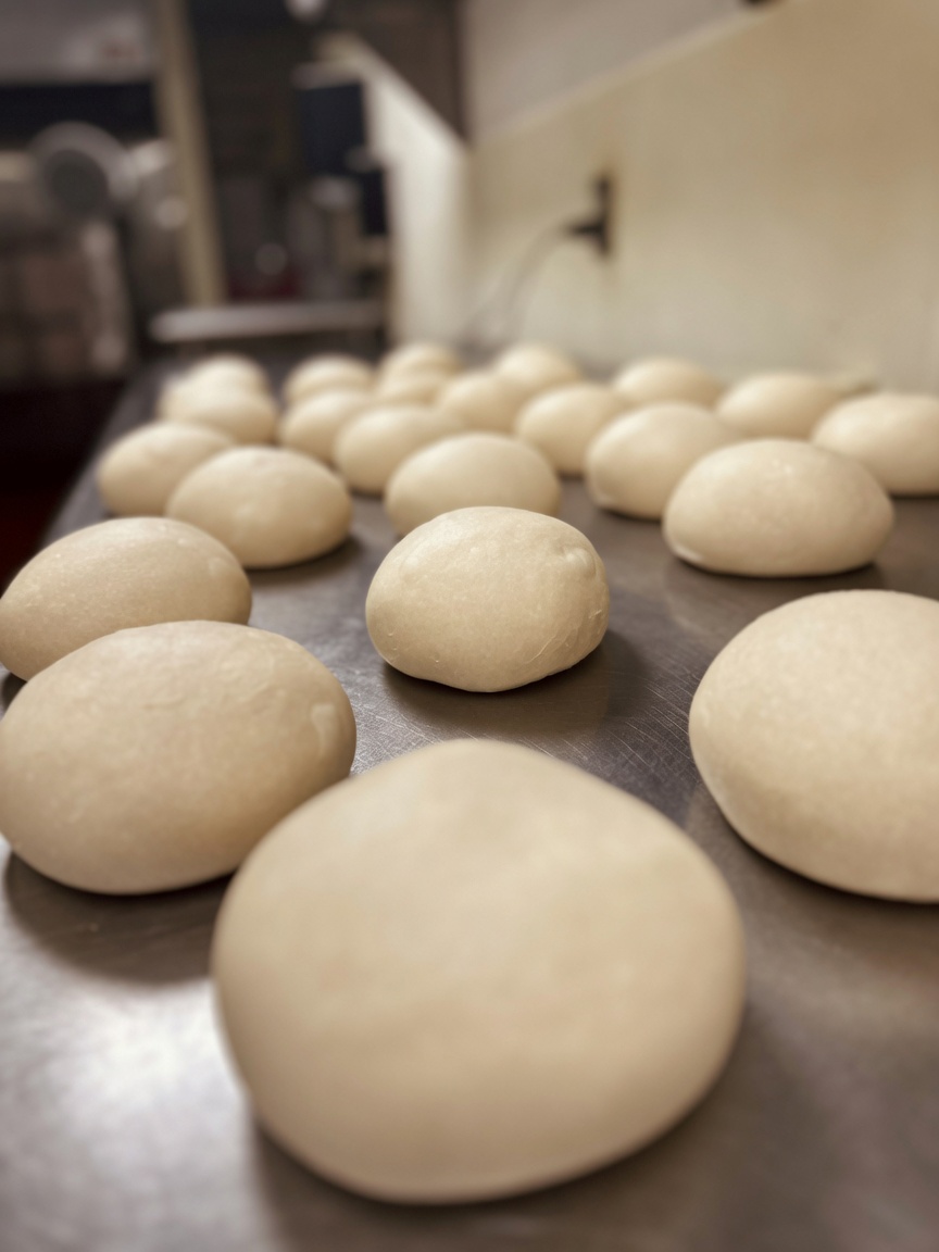 Fresh pizza dough resting in the Taste of Italy kitchen